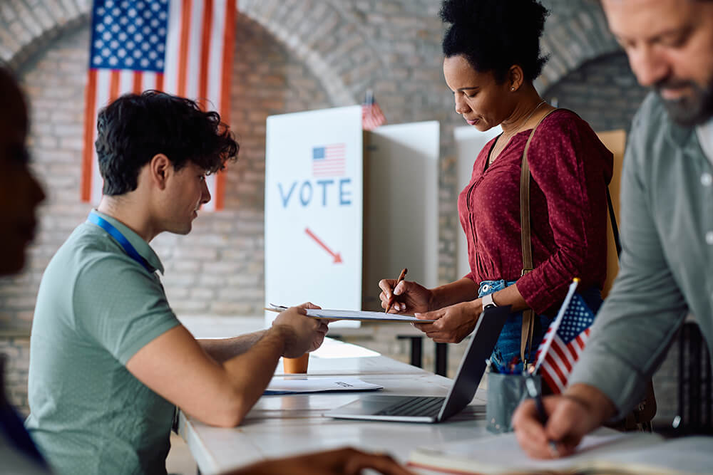 a photo of people who are younger than 40 years old registering to vote.