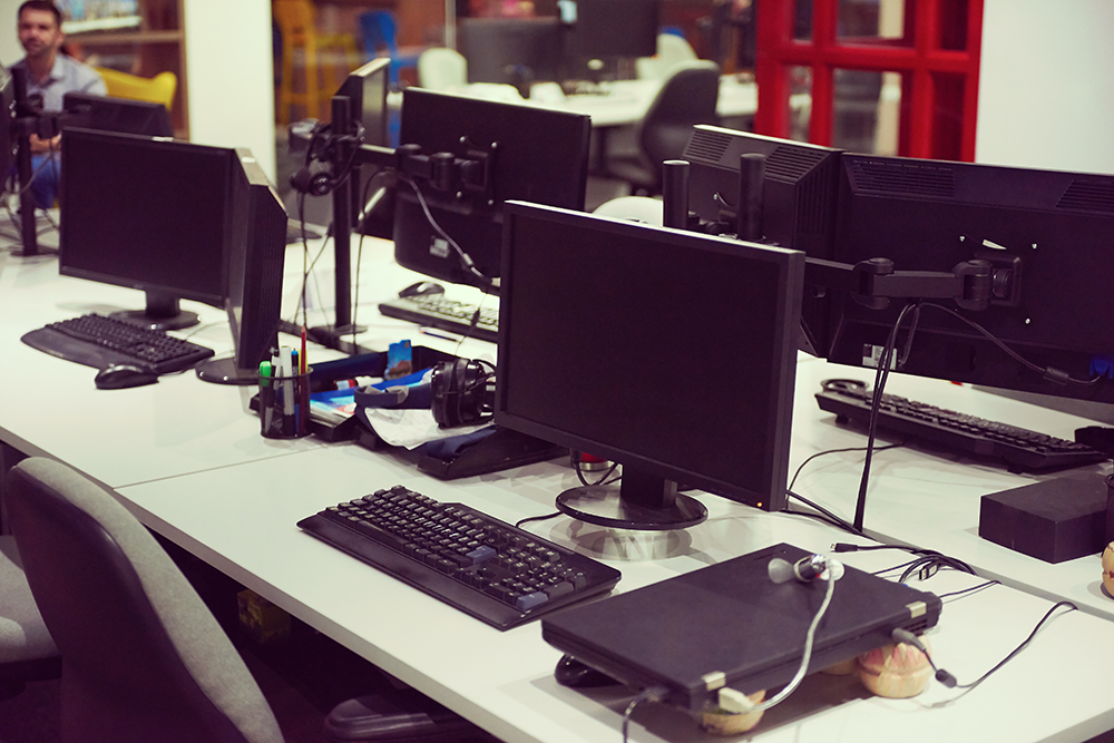 A photo of a computer lab in Youngstown where young people and returning citizens, as well as adults looking to upskill or reskill in technology attend a program called 'Code Hearted', under the Youngstown Technology Initiative.